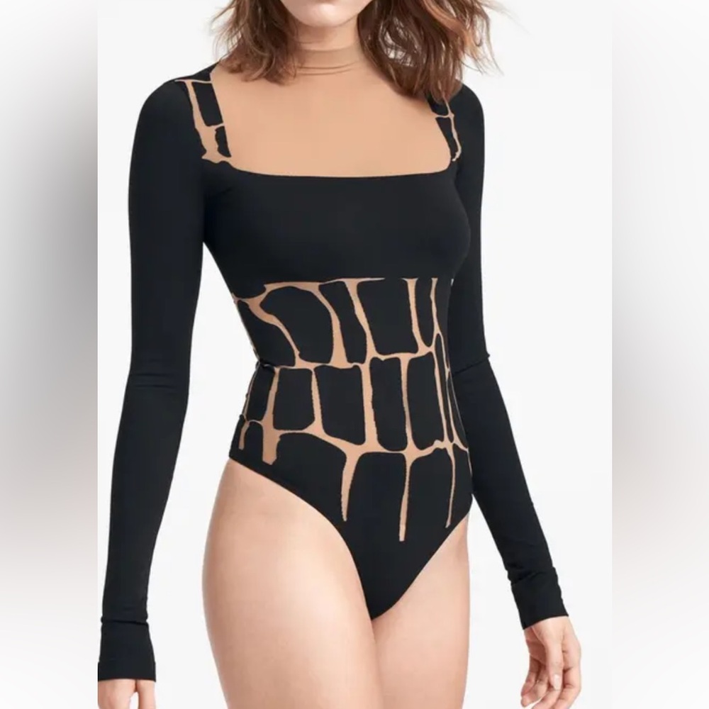 Wolford’s 
Black & Camel Pattern Long Sleeve Bodysuit